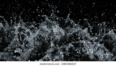 Water Exploding and Splashing against Black Background
