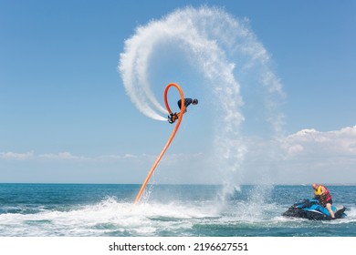 Water Extreme Sport. A Man Flies On A Water Flyboard