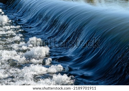 water fall from barrage of river