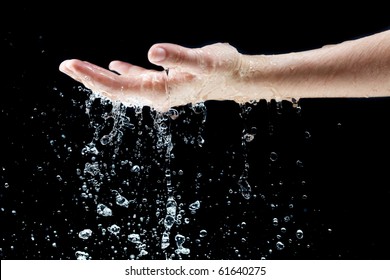 Water Falling On Hand