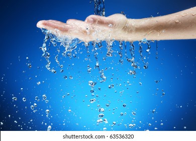 Water Falling On Hand