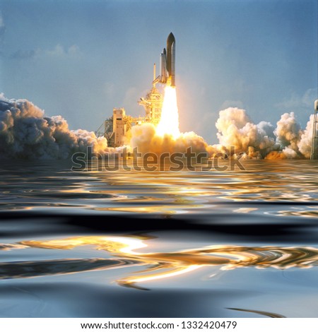 Water and fascinating liftoff of the rocket. Rocket shuttle spaceship is lifting from earth. Elements of image furnished by NASA.