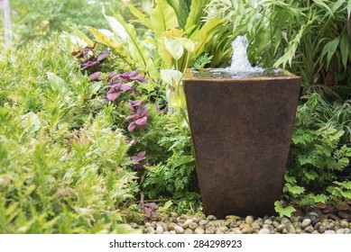 water feature in garden is Chinese belief   fountain from pot  put on right front of house is lucky - Shutterstock ID 284298923