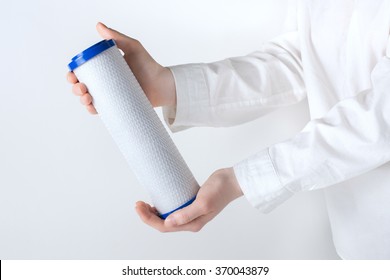 Water Filter Cartridge In Human Hands