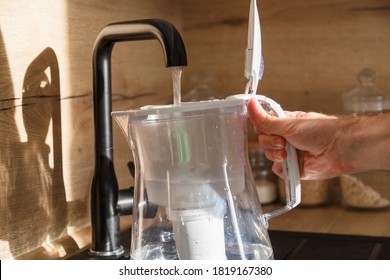 Water Filter Jug In Kitchen Sink, Filling Up.