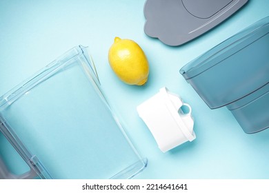 Water Filter Jug With Lemon On A Blue Background. Top View.