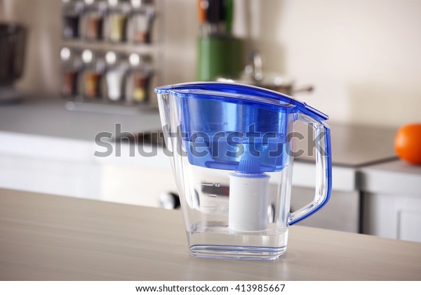 Water filter jug on kitchen\
table
