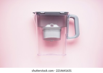 Water Filter Jug On A Pink Background. Top View.