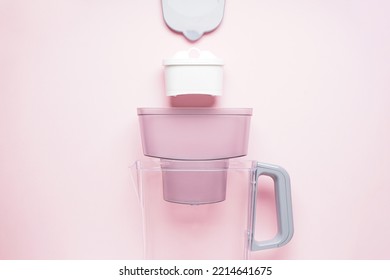 Water Filter Jug On A Pink Background. Top View.