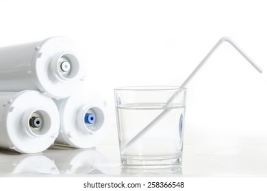 Water Filters And Glass Of Water With Drinking Straw.