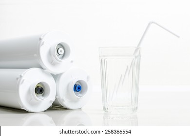 Water Filters And Glass Of Water With Drinking Straw.