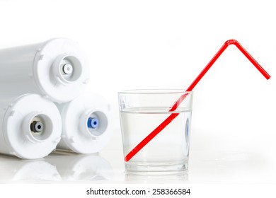 Water Filters And Glass Of Water With Drinking Straw.