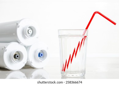 Water Filters And Glass Of Water With Drinking Straw.