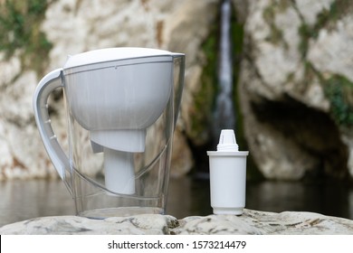 Water Filtration Pitcher With Filter, Domestic Water Purifier On The Background Of Nature