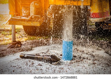 The Water Flowing Artesian Well From The Land When The Ground Water Hole Drilling Machine Installed For The Water Supply.