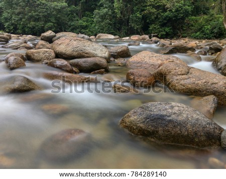 Water flowing between rock at Kuala Woh Perak Malaysia