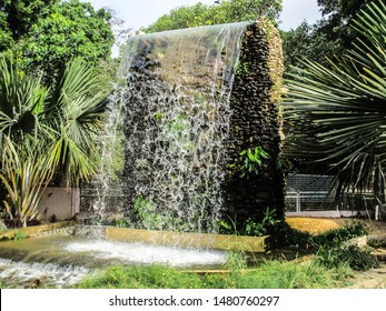 Water is flowing down from the artificial waterfall at public park in Karachi - Shutterstock ID 1480760297