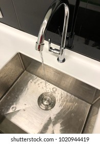 Water Flowing Down The Hole In A Kitchen Sink