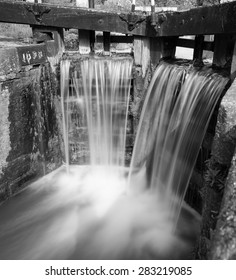 Water Flowing From An English Canal Lock.