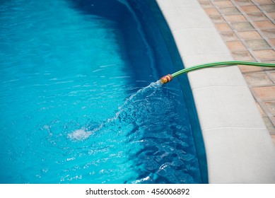 Water Flowing From The Hose Into The Pool, Filling, Servicing