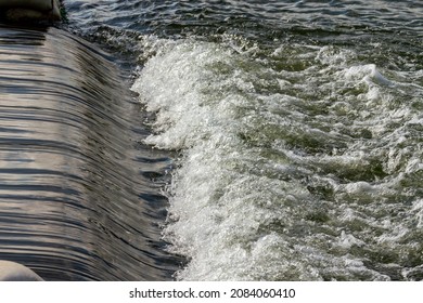 Water Flowing Over Dam Spillway.