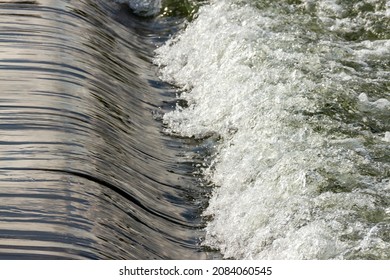 Water Flowing Over Dam Spillway.