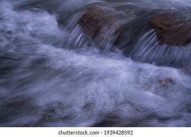 Water flowing over rocks. Abstract background.