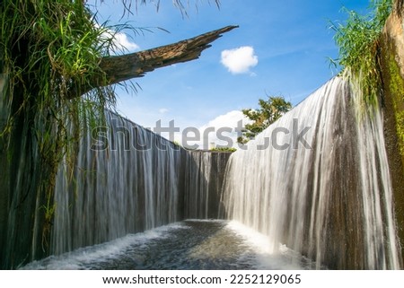 Water flowing over a weir on the Pang Sawan Weir, Uthai thani province, Thailand.