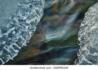 water flowing from the rocks and ice in the foreground - Shutterstock ID 2020985369