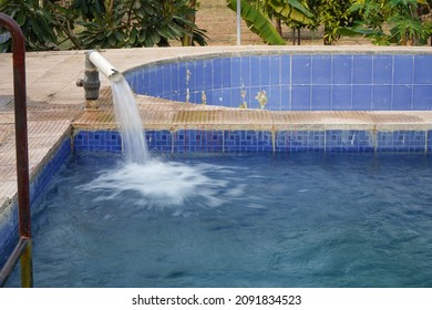 Water Flowing Through Hose Pipe In Pool Of Farmhouse