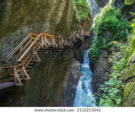 Water flowing underneath the vinding stairs in the famous canyon (sigmund-thun klamm) in austria.