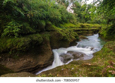 Water flows downstream to Devi's Falls in Pokhara, Nepal.