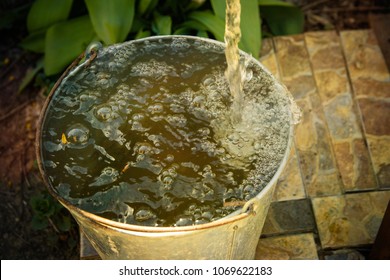 water flows into the bucket
