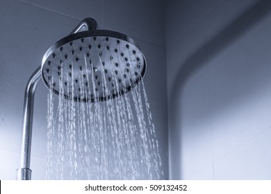 Water flows from shower of stainless steel.refreshment concept.copy space.