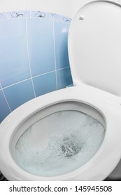 Water Flushing In Toilet Bowl Or Sink Or WC