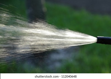 Water Flying Out Of The Hose