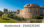 Water front park and ruins of the Fortezza Michelangelo fort in the port city of Civitavecchia,  Lazio, Italy