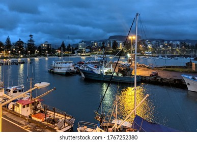 Water front view under cloudy night sky