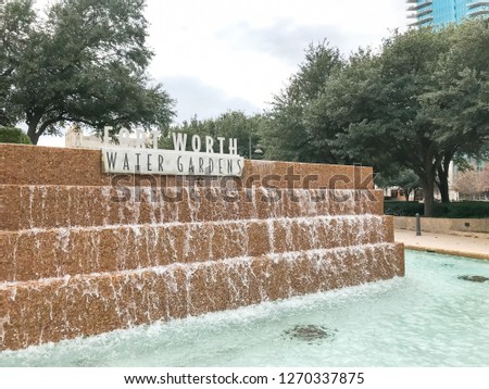 Water Gardens in downtown Fort Worth with visitors. A beautiful and refreshing oasis located downtown features three pools of water: aerating, quiet and active