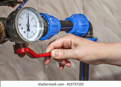 Water gauge pressure, hand shut off main valve, close-up.