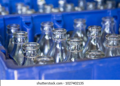 Water Glass Bottles In Blue Plastic Crate, Recycle Water Glass Bottles In Blue Box