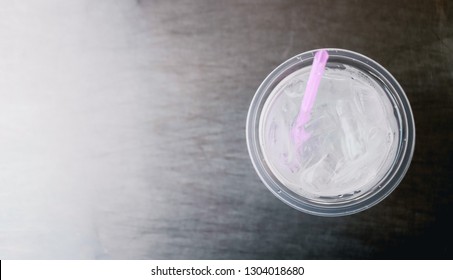 Water In The Glass On Stainless Steel Table. Top View With Copy Area.