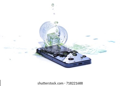 Water In Glass Spilled Smart Phone On White Background