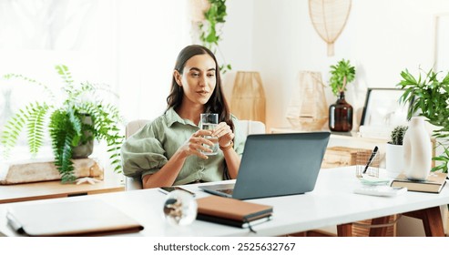 Water, glass and woman at laptop in home office for research, review and business plan for freelance project. Remote work, relax and consultant at desk with drink, computer and reading online article