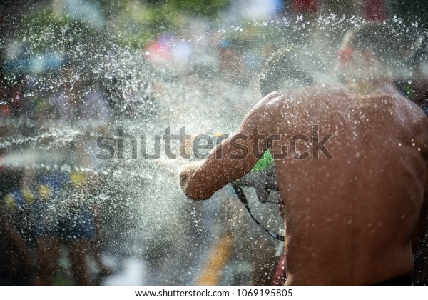 water gun\
fighting at songkran festival in\
Thailand