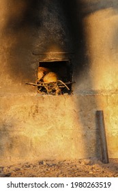 Water Heating Technique Using Coconut Husk And Dry Woods In The Village