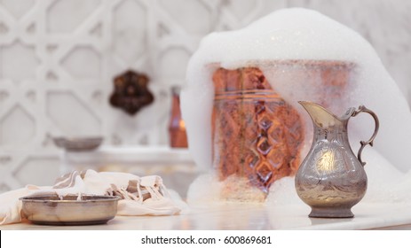 Water jar, towel and copper bowl with soap foam in turkish hamam. Traditional interior details. Horizontal, wide screen format - Shutterstock ID 600869681