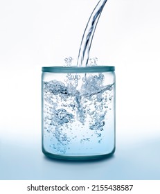 Water jet splashing into a glass jar against white and blue color background