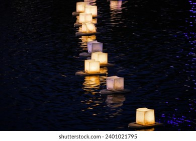 water lanterns float on the calm lake