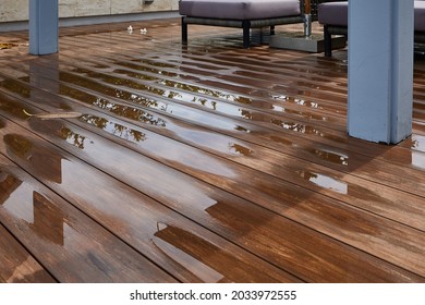 Water leaking and flooded on wood  floor. Room floor will damage after the water flooded.
